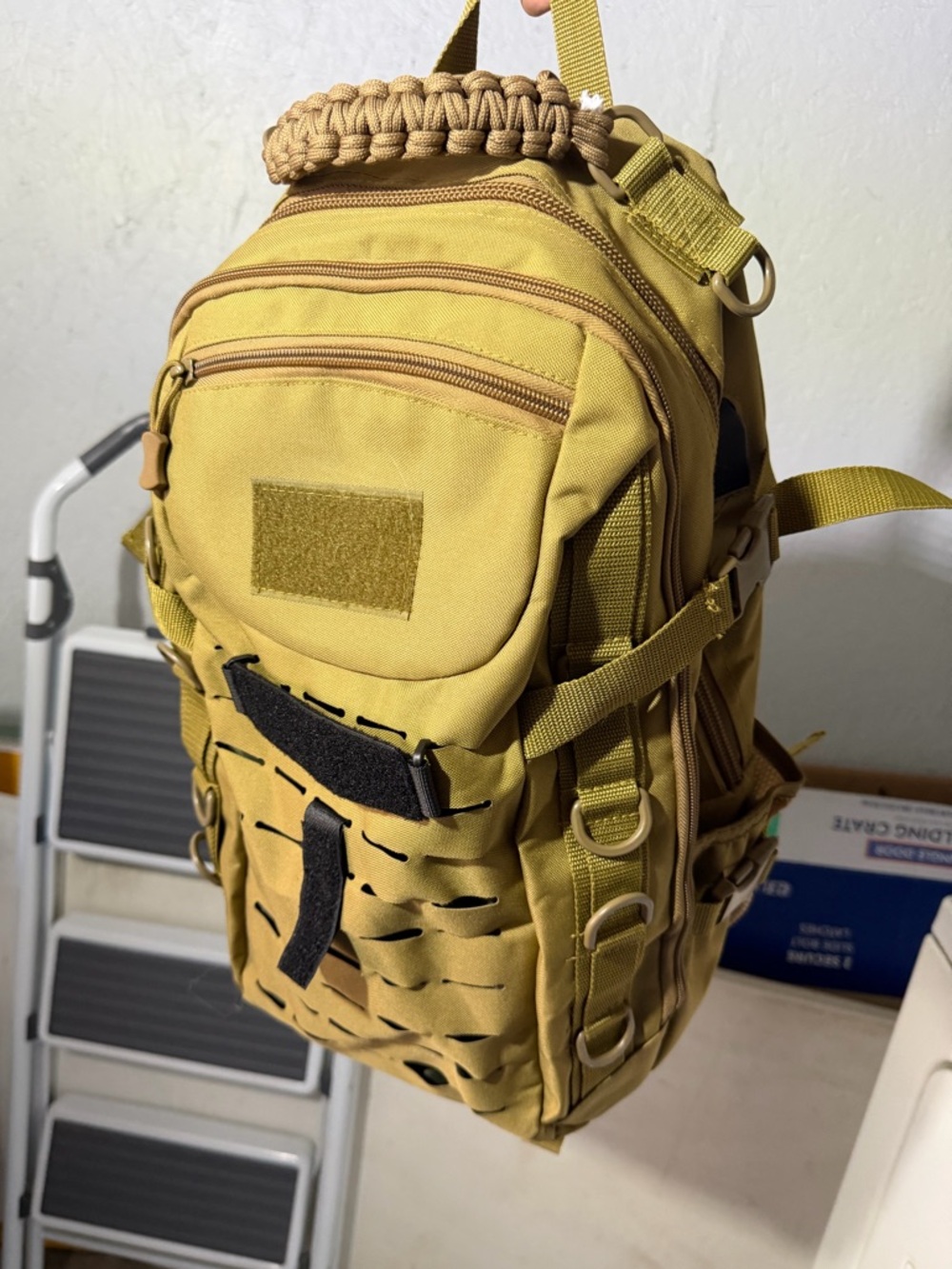 Khaki tactical backpack with Molle attachments and usb pass-threw